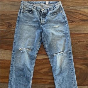 Washed out boyfriend ripped hipster blue jeans.